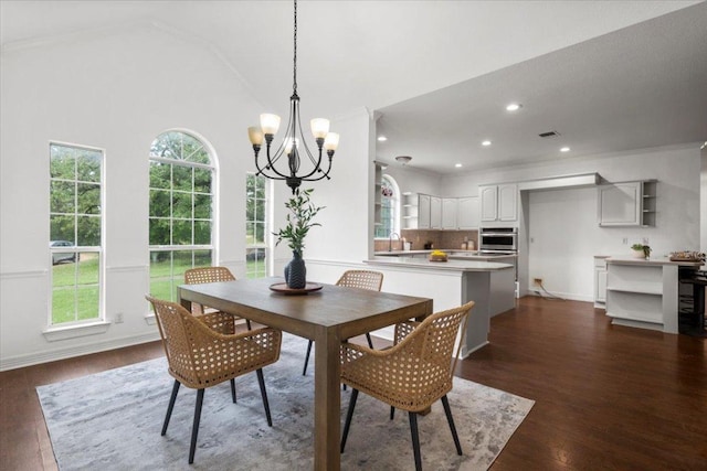 1109 Sherrill Ln, Lexington, TX 78947 - dining area with a chandelier, dark wood finished floors, vaulted ceiling, and recessed lighting