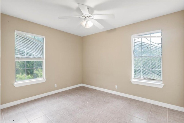1109 Sherrill Ln, Lexington, TX 78947 - spare room featuring healthy amount of natural light, light tile patterned floors, and a ceiling fan