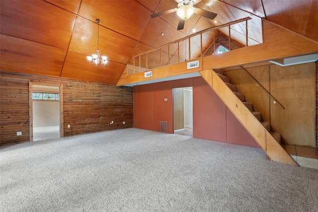 111 Sendero Blvd, Cedar Creek, TX 78612 - unfurnished living room featuring wood walls, wooden ceiling, high vaulted ceiling, a ceiling fan, and carpet floors