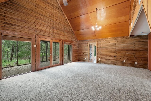 111 Sendero Blvd, Cedar Creek, TX 78612 - carpeted empty room featuring wooden walls, wooden ceiling, and high vaulted ceiling