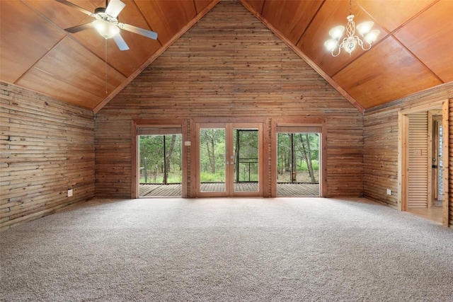 111 Sendero Blvd, Cedar Creek, TX 78612 - unfurnished living room with wooden ceiling, lofted ceiling, wood walls, a chandelier, and ceiling fan