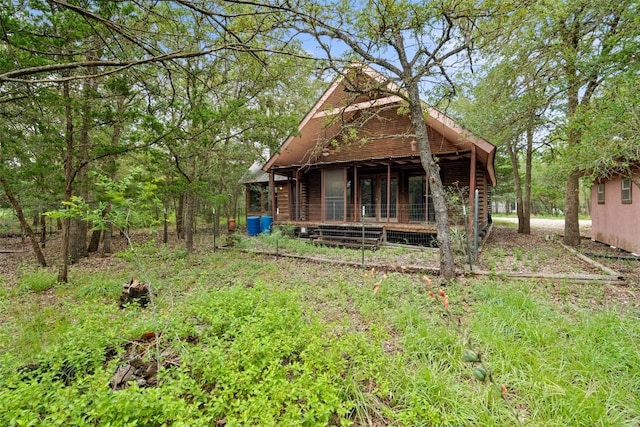 111 Sendero Blvd, Cedar Creek, TX 78612 - rear view of house with a porch