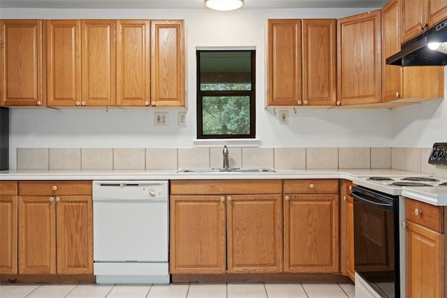 111 Sendero Blvd, Cedar Creek, TX 78612 - kitchen featuring dishwasher, electric range, under cabinet range hood, light countertops, and brown cabinets