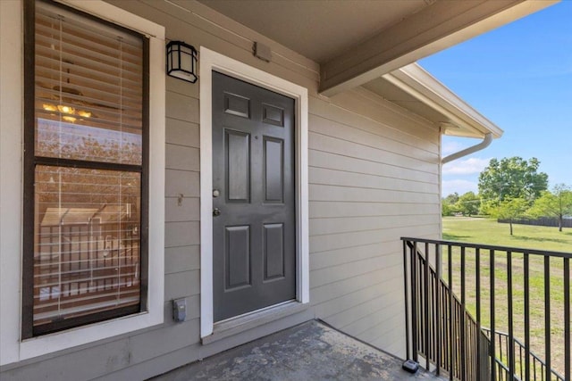 10616 Mellow Meadows Dr Unit 21C, Austin, TX 78750 - view of exterior entry with covered porch and a yard