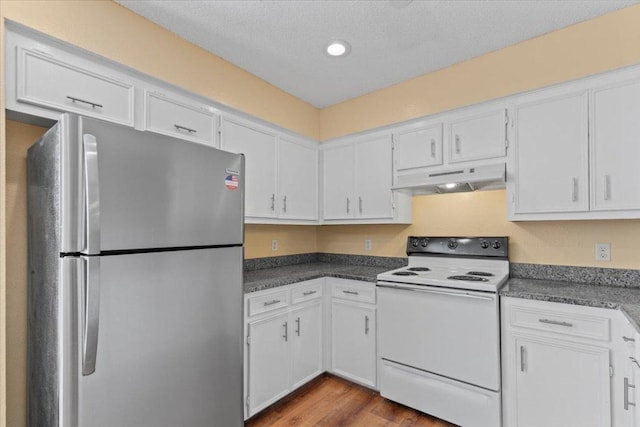 10616 Mellow Meadows Dr Unit 21C, Austin, TX 78750 - kitchen featuring freestanding refrigerator, white range with electric cooktop, under cabinet range hood, white cabinetry, and recessed lighting