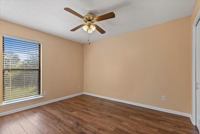 10616 Mellow Meadows Dr Unit 21C, Austin, TX 78750 - empty room featuring ceiling fan, wood finished floors, and a textured ceiling