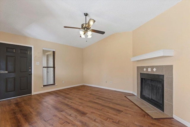 10616 Mellow Meadows Dr Unit 21C, Austin, TX 78750 - unfurnished living room with vaulted ceiling, ceiling fan, wood finished floors, and a fireplace