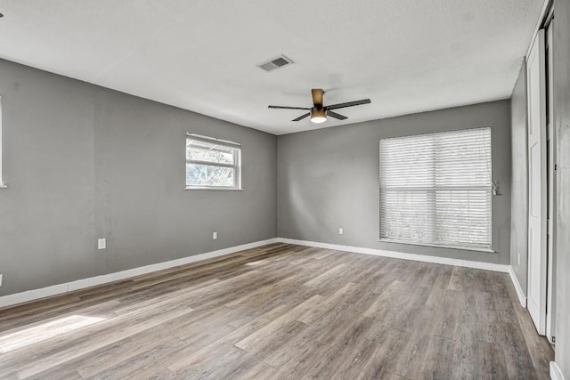 908 Hollybluff St, Austin, TX 78753 - empty room featuring a ceiling fan and wood finished floors