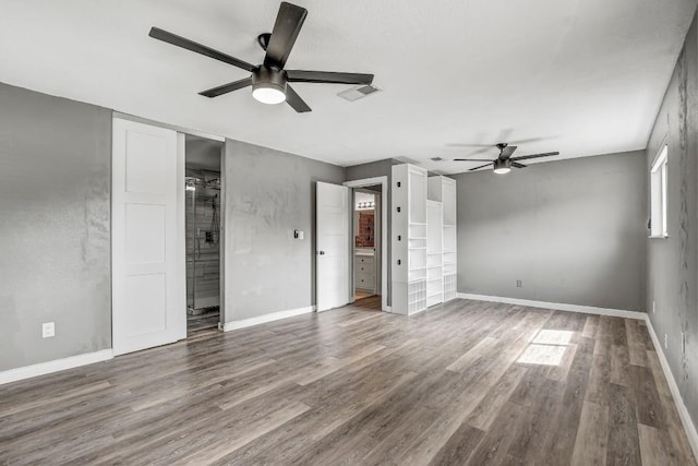 908 Hollybluff St, Austin, TX 78753 - unfurnished bedroom with wood finished floors and ceiling fan