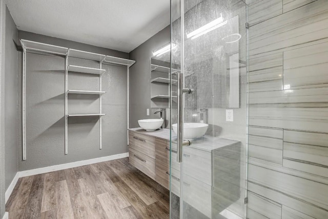908 Hollybluff St, Austin, TX 78753 - walk in closet with a sink and wood finished floors