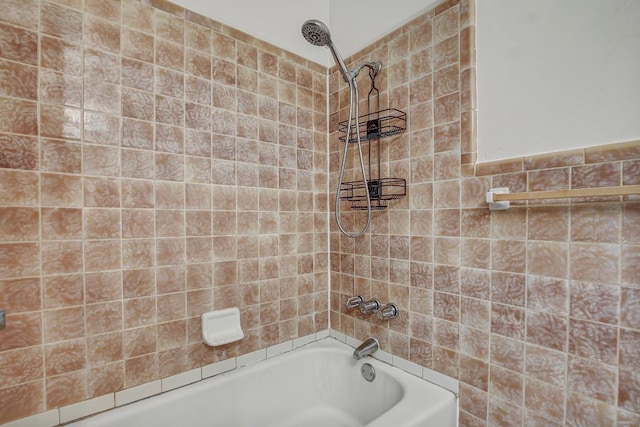 908 Hollybluff St, Austin, TX 78753 - bathroom featuring shower / washtub combination and tile walls