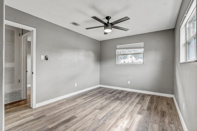 908 Hollybluff St, Austin, TX 78753 - spare room featuring a ceiling fan, plenty of natural light, and wood finished floors