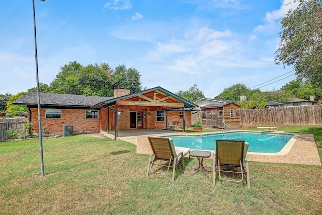 908 Hollybluff St, Austin, TX 78753 - view of swimming pool featuring a fenced backyard, a patio, a storage shed, and a diving board