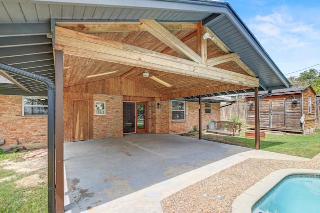 908 Hollybluff St, Austin, TX 78753 - rear view of property with a patio area, a carport, a storage unit, an outdoor pool, and brick siding