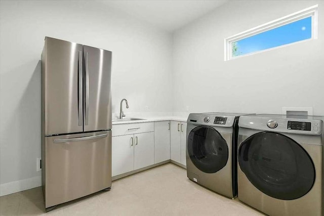 512 Cowal Dr S, Spicewood, TX 78669 - washroom featuring baseboards and washer and clothes dryer
