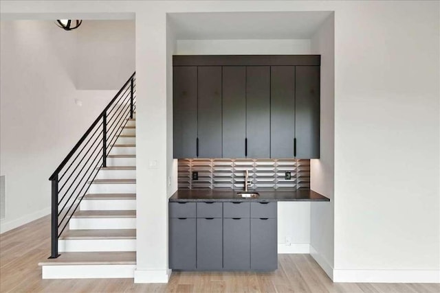 512 Cowal Dr S, Spicewood, TX 78669 - stairs with wood finished floors