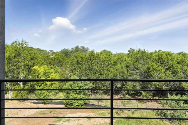 512 Cowal Dr S, Spicewood, TX 78669 - balcony featuring a view of trees