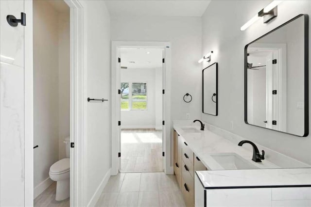 512 Cowal Dr S, Spicewood, TX 78669 - full bath featuring double vanity and tile patterned floors