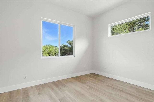 512 Cowal Dr S, Spicewood, TX 78669 - empty room featuring baseboards and light wood finished floors