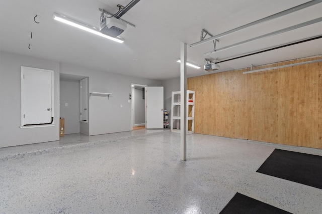 1707 Creek Bend Cir, Round Rock, TX 78681 - garage with a garage door opener and wooden walls