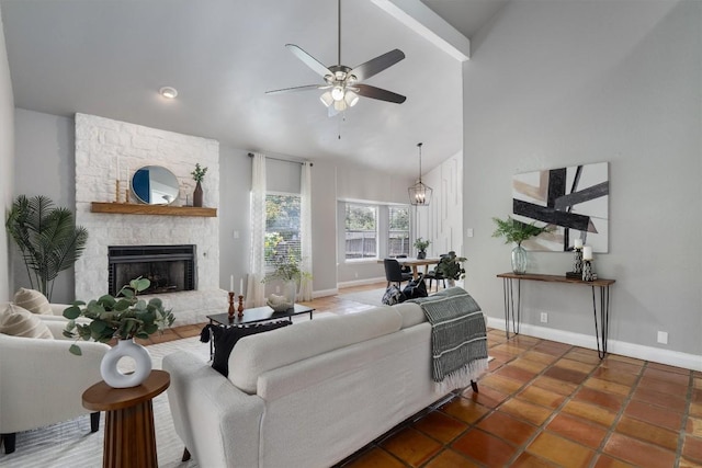 1707 Creek Bend Cir, Round Rock, TX 78681 - tiled living room featuring ceiling fan, a stone fireplace, high vaulted ceiling, and beamed ceiling