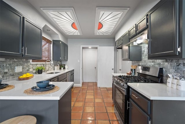 1707 Creek Bend Cir, Round Rock, TX 78681 - kitchen featuring appliances with stainless steel finishes, decorative backsplash, under cabinet range hood, and a peninsula