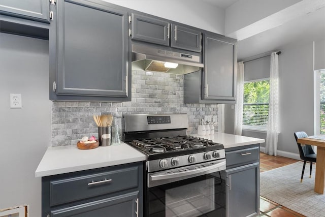1707 Creek Bend Cir, Round Rock, TX 78681 - kitchen featuring stainless steel gas range oven, under cabinet range hood, tasteful backsplash, and light countertops