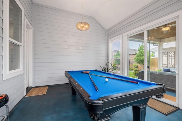 6708 Leonardo Dr, Round Rock, TX 78665 - recreation room with lofted ceiling, pool table, wood walls, and finished concrete flooring