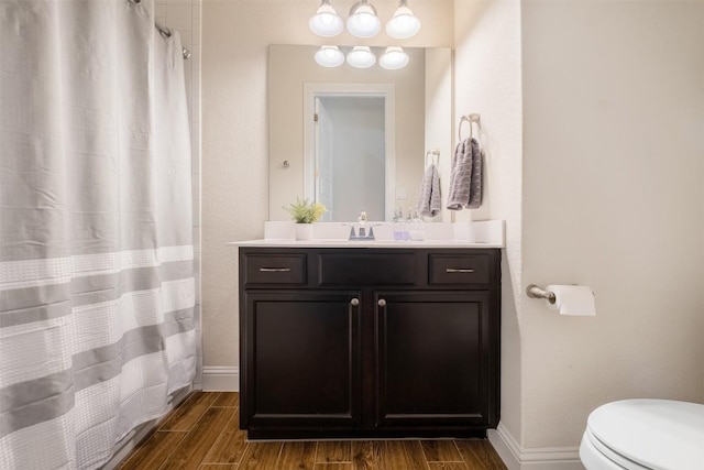 6708 Leonardo Dr, Round Rock, TX 78665 - bathroom with vanity, wood finished floors, and curtained shower