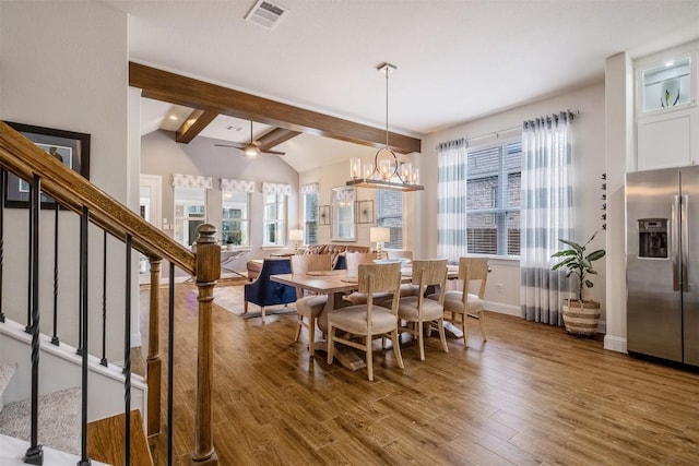 6708 Leonardo Dr, Round Rock, TX 78665 - dining room featuring wood finished floors, stairs, ceiling fan, and a chandelier