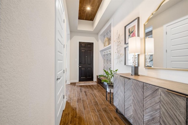 6708 Leonardo Dr, Round Rock, TX 78665 - foyer entrance with dark wood-style flooring, a tray ceiling, and recessed lighting