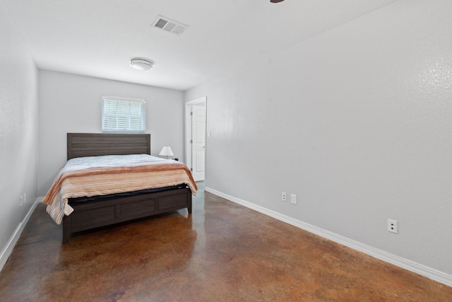 5700 Jain Ln, Austin, TX 78721 - bedroom with baseboards and finished concrete floors