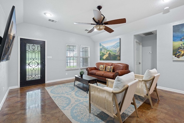 5700 Jain Ln, Austin, TX 78721 - living room featuring vaulted ceiling, finished concrete floors, and a ceiling fan