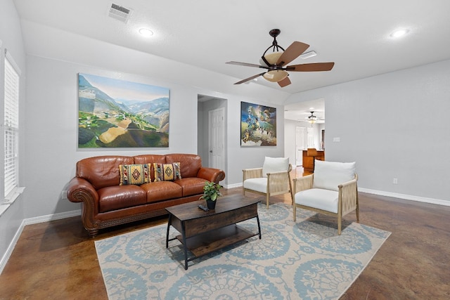 5700 Jain Ln, Austin, TX 78721 - living area with concrete flooring, a ceiling fan, and recessed lighting