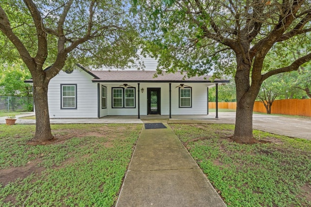 5700 Jain Ln, Austin, TX 78721 - ranch-style home featuring ceiling fan, covered porch, and roof with shingles