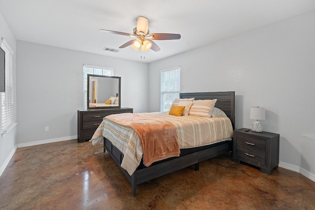 5700 Jain Ln, Austin, TX 78721 - bedroom with concrete flooring and ceiling fan
