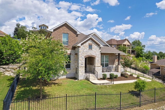 2304 Arroyo Grande, Leander, TX 78641 - view of front of property featuring stone siding, a porch, roof with shingles, and brick siding