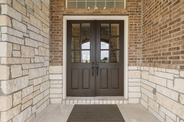 2304 Arroyo Grande, Leander, TX 78641 - doorway to property with french doors and brick siding