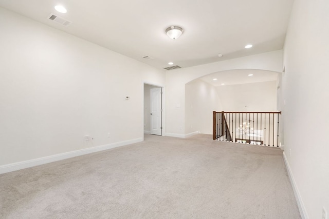 2304 Arroyo Grande, Leander, TX 78641 - empty room with light colored carpet, recessed lighting, and arched walkways