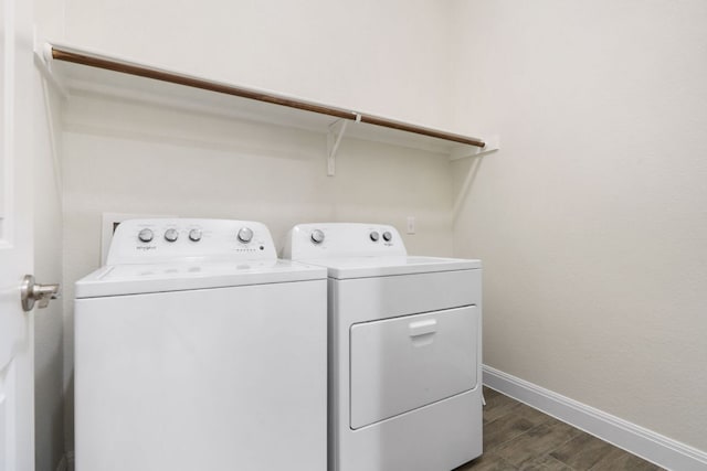 2304 Arroyo Grande, Leander, TX 78641 - laundry room with washing machine and clothes dryer and dark wood finished floors