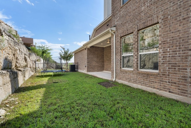 2304 Arroyo Grande, Leander, TX 78641 - view of yard featuring a trampoline and a patio area