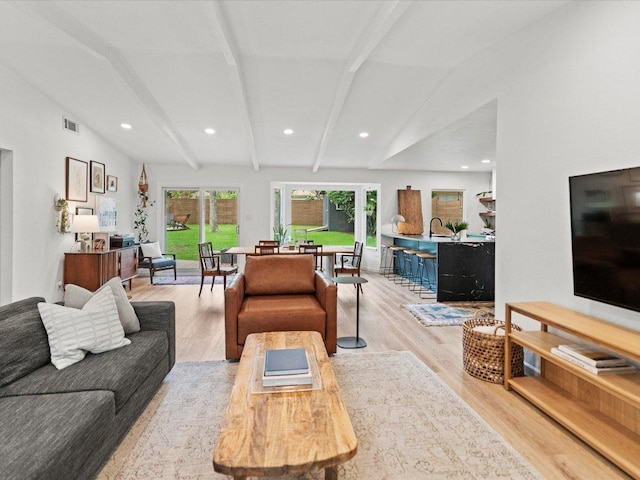 1907 Parkside Ln, Austin, TX 78745 - living room with light wood finished floors and recessed lighting