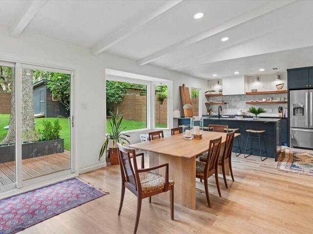1907 Parkside Ln, Austin, TX 78745 - dining room featuring beam ceiling, plenty of natural light, light wood-type flooring, and recessed lighting