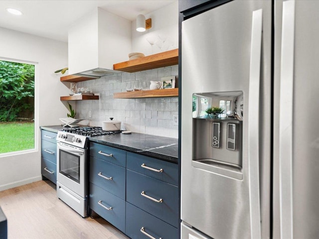 1907 Parkside Ln, Austin, TX 78745 - kitchen featuring stainless steel appliances, open shelves, light wood-type flooring, blue cabinetry, and recessed lighting