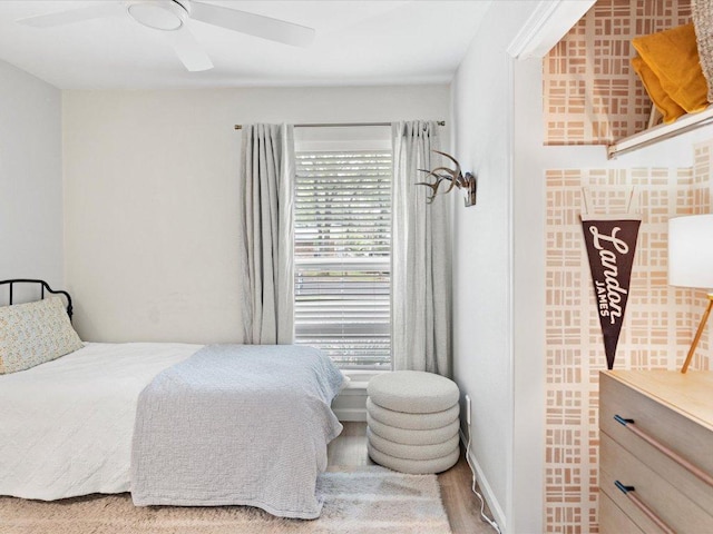 1907 Parkside Ln, Austin, TX 78745 - bedroom with a ceiling fan and wood finished floors