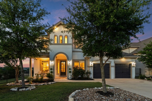1304 Positano Pass, Leander, TX 78641 - mediterranean / spanish-style house with driveway, stucco siding, and an attached garage