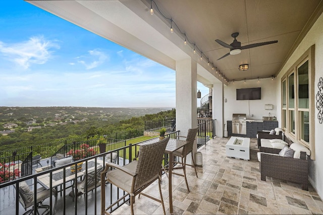 1304 Positano Pass, Leander, TX 78641 - balcony with exterior kitchen, ceiling fan, and outdoor lounge area