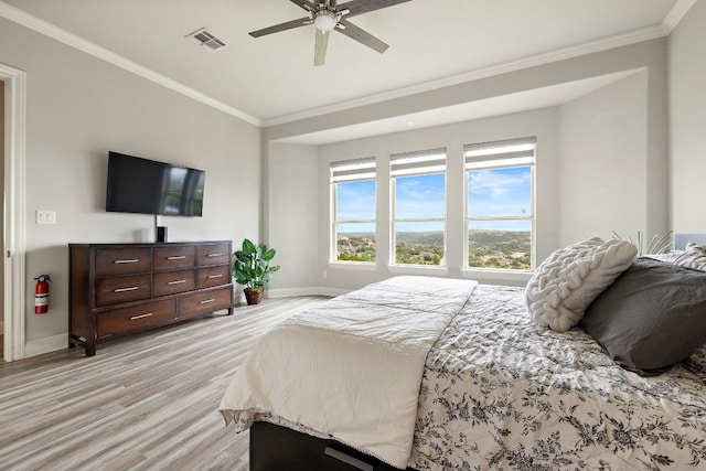 1304 Positano Pass, Leander, TX 78641 - bedroom with light wood-style floors, crown molding, and a ceiling fan