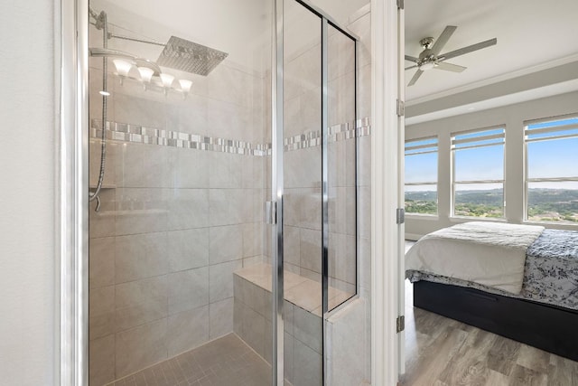 1304 Positano Pass, Leander, TX 78641 - bathroom with ensuite bath, a stall shower, ceiling fan, crown molding, and wood finished floors