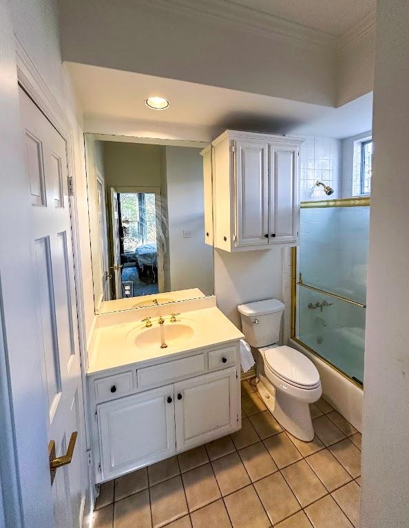 4119 Hidden Canyon Cv, Austin, TX 78746 - full bathroom with tile patterned floors, vanity, enclosed tub / shower combo, crown molding, and recessed lighting